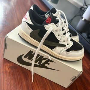 Travis Scott Jordan 1. 9c black , cream , red , olive green.